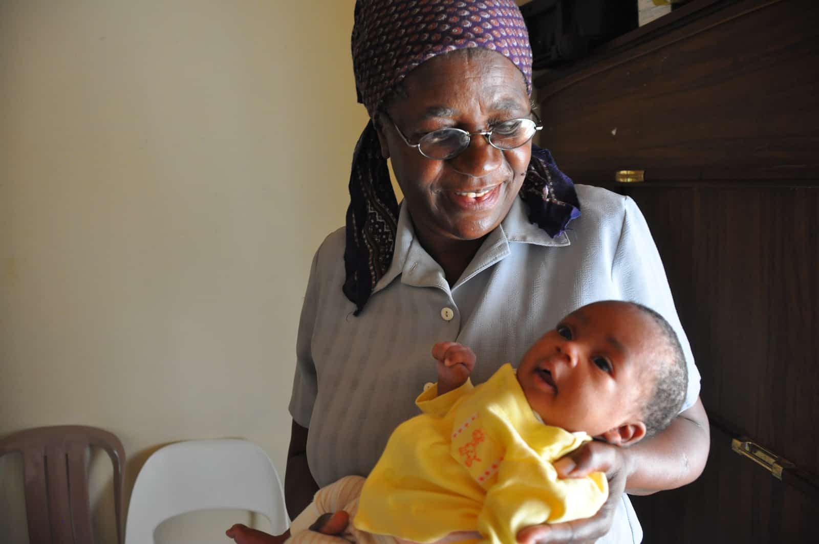 African woman holding baby