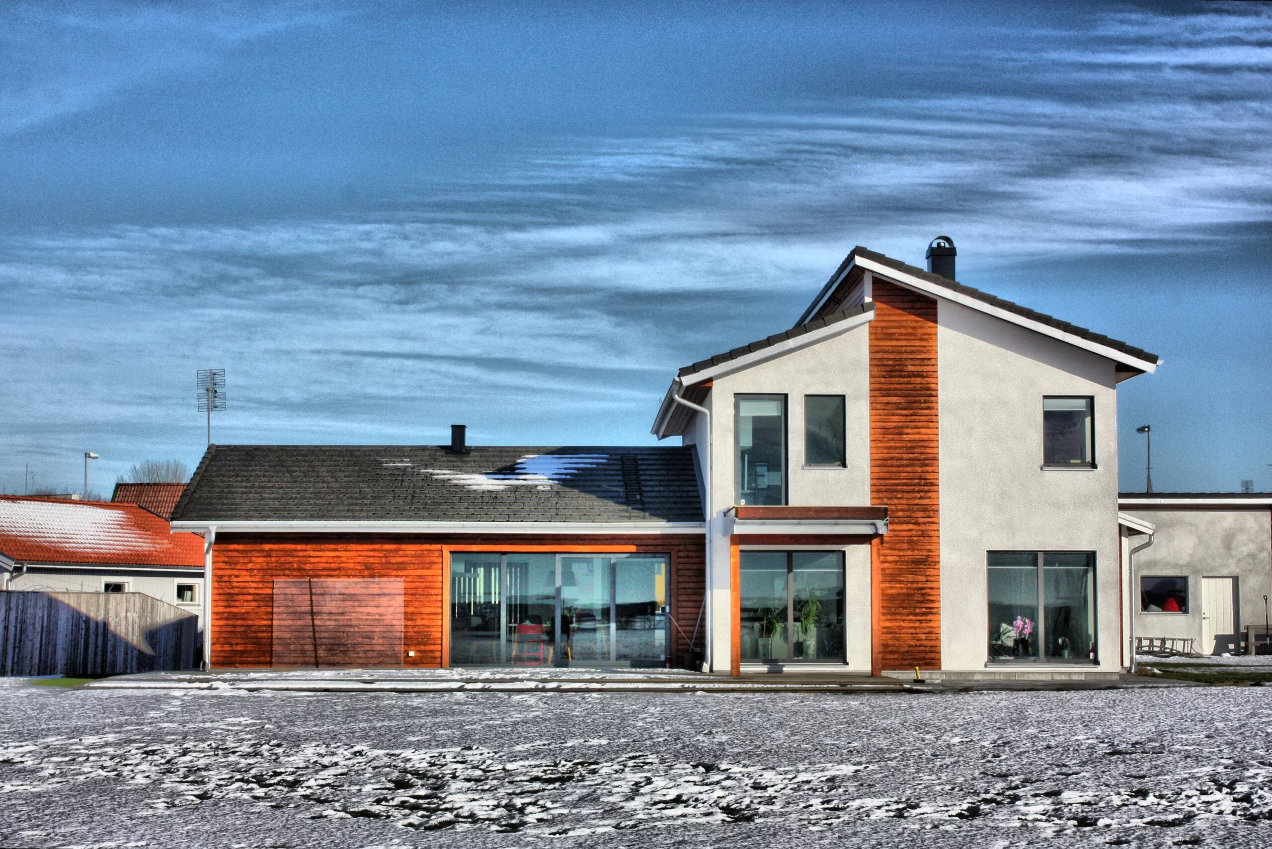 Modern design of house with empty sky background and concrete gravel frontage